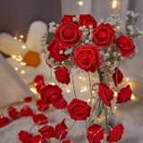 Red roses table decoration or centrepiece - battery powered string fairy lights