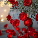 Red roses table decoration or centrepiece - battery powered string fairy lights
