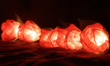 Red roses table decoration or centrepiece - battery powered string fairy lights
